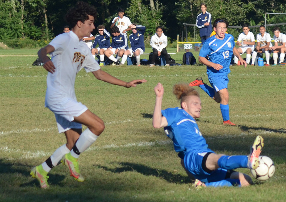 Valley Central’s Dominic Ciano slides after the ball as Pine Bush’s Joseph Darrell pursues and Valley Central’s Kyle Cocks looks on during Friday’s OCIAA boys’ soccer game at Valley Central High School in Montgomery.